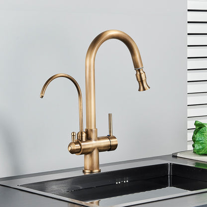 A person uses the Rozin Touch Sensor Antique Brass Kitchen Faucet with Filtered Water Tap to wash their hands. The elegant faucet features dual handles and a high-arc spout, providing a modern touch to the kitchen sink area, which is immaculate against a backdrop of white and green-striped walls.