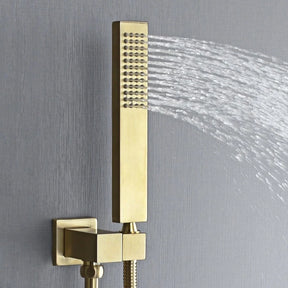 A modern bathroom features AllFixture's Wall Mounted Complete Shower Set With Handheld Sprayer in a sleek, gold-tone. The shower fixtures are mounted against a white wall, complemented by a stylish bathroom sink faucet nearby. A framed picture with green and yellow abstract art is visible near a clear glass shower screen.