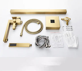 A modern brass Wasser™ Floor Mounted Bathtub Filler Shower Set by allfixture is installed against a gray wall. Water sprays horizontally from the handheld shower head attached to the fixture. The sleek, angular design and lever handle for controlling flow enhance its elegance. Below, the edge of a white bathtub is visible.