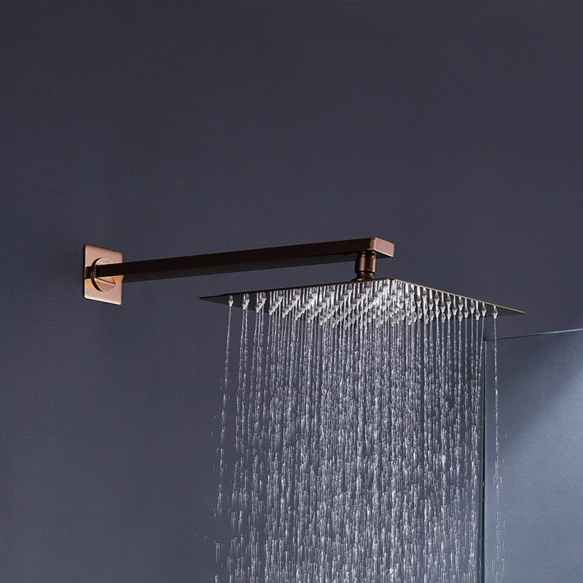 The Wasser™ Rose Gold Complete Shower System With Bathtub Filler by AllFixture is a modern shower setup with a sleek, rose gold finish. It features a ceiling-mounted rainfall showerhead, a handheld showerhead attached to a flexible hose, dual-control knobs, and a spout, all mounted on a dark-colored wall. This elegant system could easily be adapted as a stylish shower faucet for your bathroom.