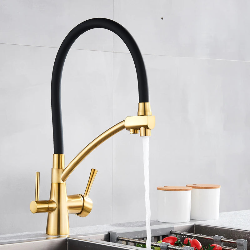 Over a stainless steel sink, the Solid Brass Kitchen Faucet With Purified Water Tap from allfixture takes center stage with its sleek, gold finish and flexible black hose. The background boasts a grey backsplash and two white canisters with wooden lids on the countertop, echoing the elegance of premium bathroom faucets.