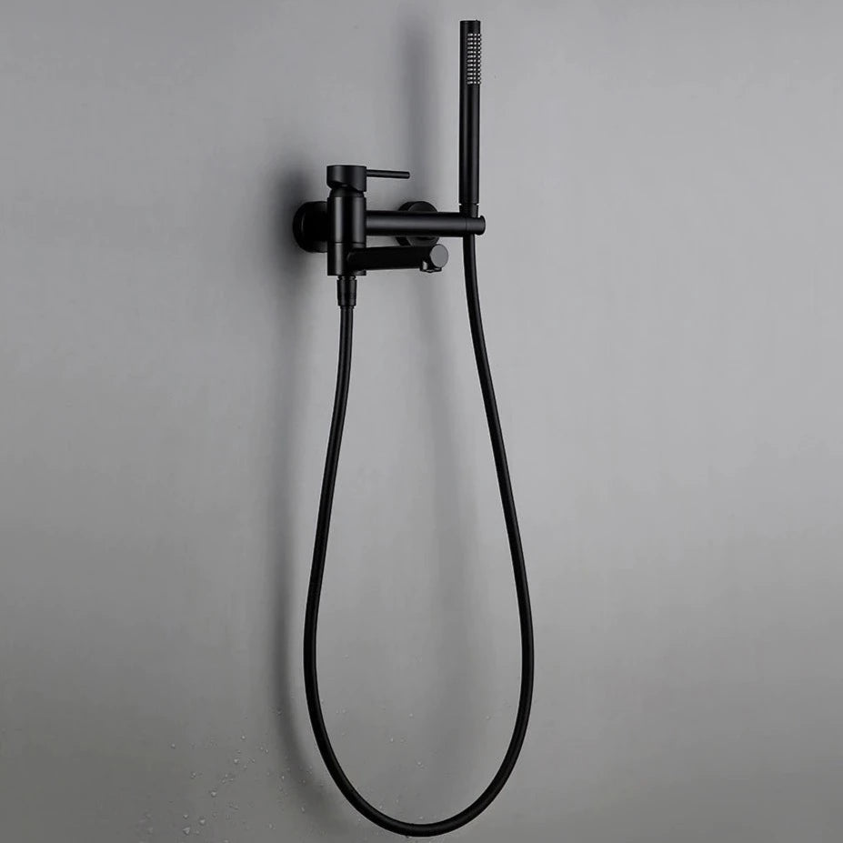 Mounted on a gray bathroom wall, the AllFixture Wasser™ Wall Mounted Bathtub Spout With Hand Shower features a sleek, modern matte black finish. It comes with a single lever handle for temperature control and an adjustable handheld showerhead attached to a flexible hose, highlighting its minimalist and contemporary design.