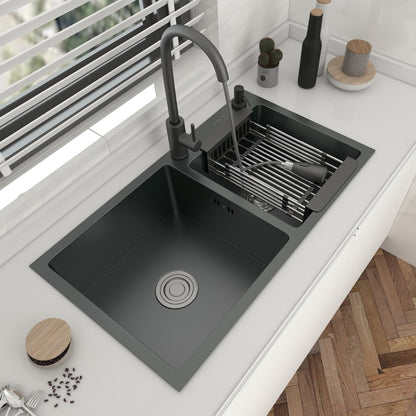 A modern AllFixture 304 Stainless Steel Double Bowl Kitchen Sink with a matte black finish is installed on a countertop. The kitchen faucet features a deep basin with a circular drain, a black handle, and an adjacent drying rack with a dish and soap dispenser. A small bowl of butter is on the counter.