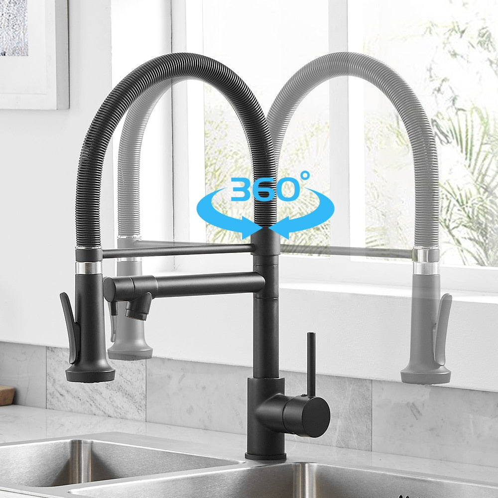 A close-up image showcases the Wanfan™ Dual Spout Kitchen Faucet by allfixture, featuring a sleek, flexible arched neck and a convenient pull-down sprayer. The faucet's 360-degree rotation capability is highlighted with an arrow and "360°" text above it. The background reveals a bright kitchen with a sink and window, echoing the contemporary design found in modern bathroom fixtures.