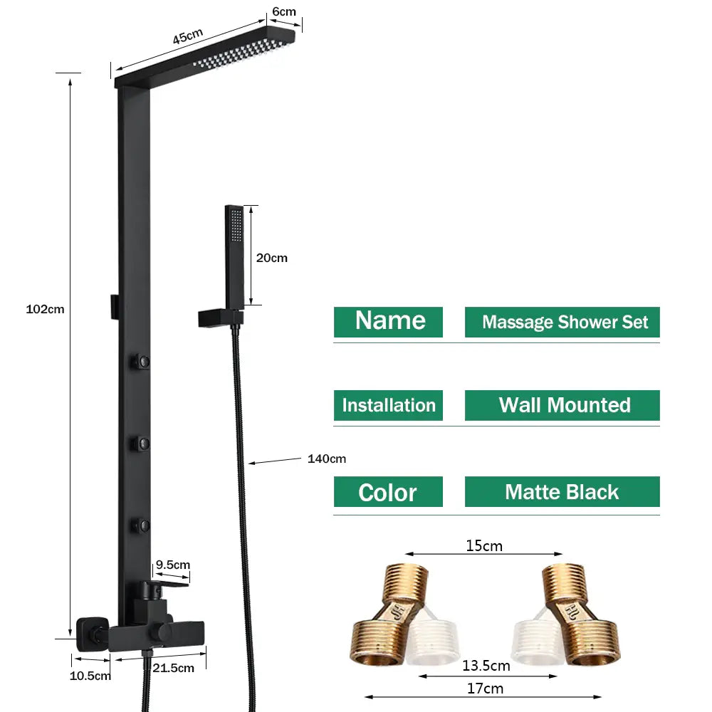 The tiled shower area features a Matte Black Wall Mounted Shower Panel With Massage Jets from Morsale.com. The panel boasts a rainfall showerhead, handheld shower wand, and three horizontal body jets, all emitting streams of water simultaneously. Complementing the sleek design are matching bathroom faucets and a white towel hanging on a nearby rack.