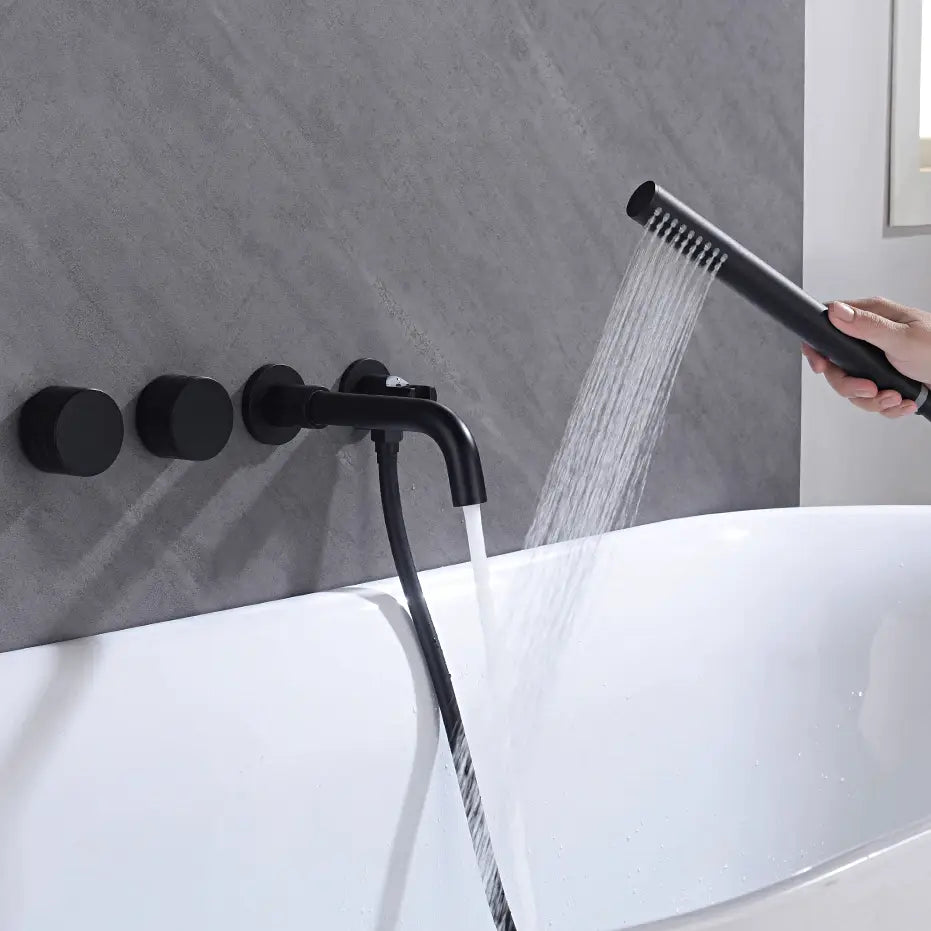 A contemporary grey tiled bathroom features the AllFixture Shower Faucet Set Mixer Valve With Bathtub Filler. This modern ensemble includes a sleek black shower faucet, two round control knobs, and a hand-held shower head spraying water, embodying minimalist and stylish design.