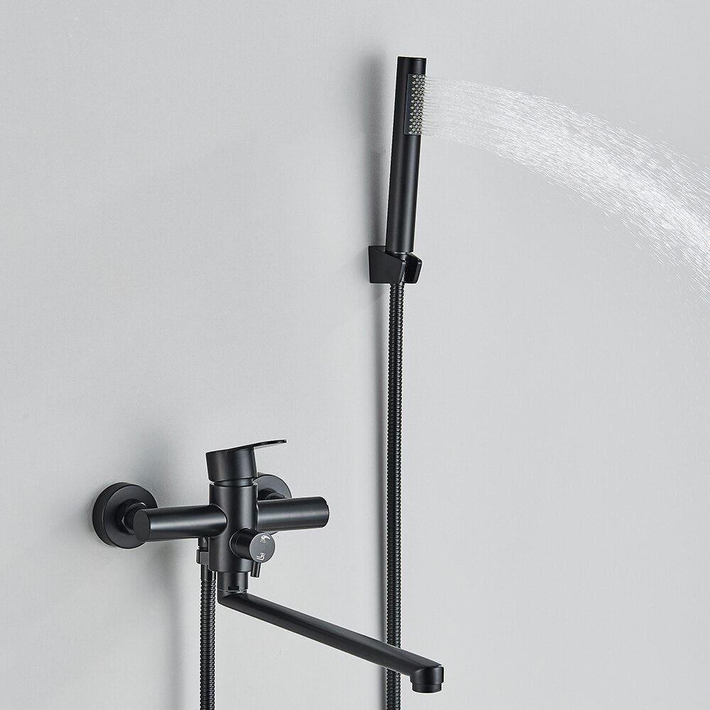 The Wall Mounted Bathtub Shower Faucet With Handheld Shower by Rozin is a sleek, modern fixture. It features a matte black finish, a single lever handle, and a detachable hand shower with a slim, cylindrical design. The faucet itself has a swiveling spout, and the hand shower is conveniently mounted on the wall above it.