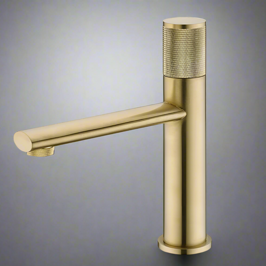 The Wanfan Knob Switch Solid Brass Bathroom Faucet showcases a modern design with a brushed gold finish. This cylindrical faucet features a textured single handle on top for precise temperature and water flow control, complemented by a sleek, straight spout extending horizontally from the base.
