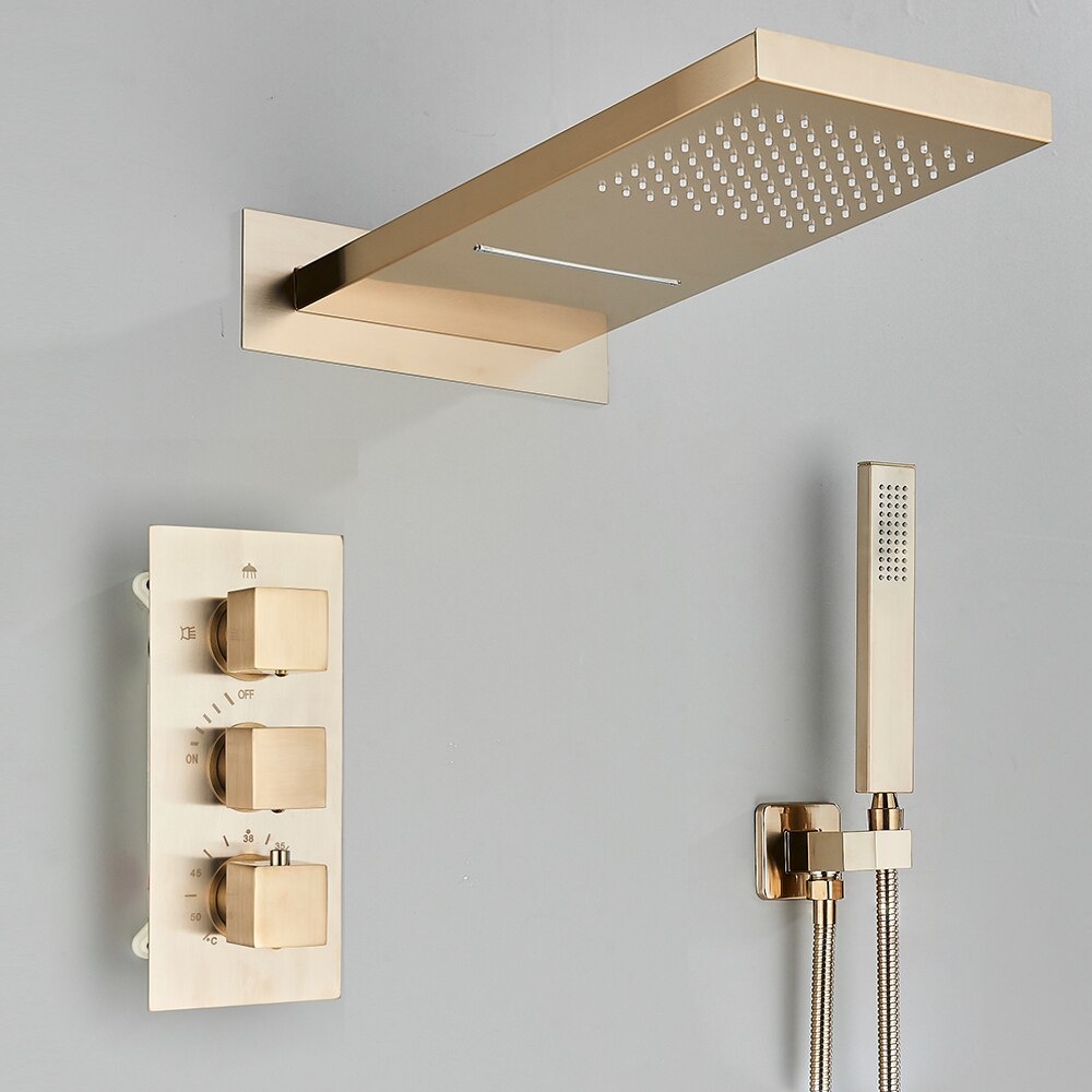 A minimalist shower setup is showcased by AllFixture's Thermostatic Wall Mounted Waterfall Rainfall Shower Head System, featuring a square, gold-toned overhead showerhead, three gold control knobs on a rectangular panel, and a matching handheld showerhead mounted on the wall. This sleek design with its gray background is complemented by an elegant AllFixture gold shower faucet.