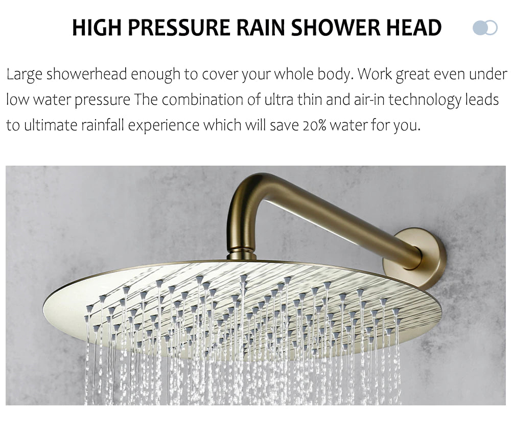 A modern minimalist shower setup features the Wasser™ Brushed Gold Shower System with Handheld Sprayer by Morsale.com, showcasing a large, round, wall-mounted rain showerhead and a sleek handheld shower spray emitting water. The brushed gold fixtures, including complementary bathroom faucets, accentuate the textured gray tile wall. Two control knobs are visible below.