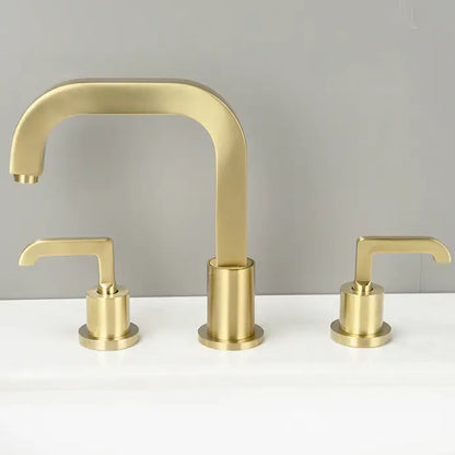 The Wasser™ Deck Mounted Dual Handle Bathroom Faucet by AllFixture is displayed against a light gray background. This modern three-piece brushed gold bathroom set features a central curved spout and two separate lever handles for hot and cold water, all boasting a sleek, minimalistic design.